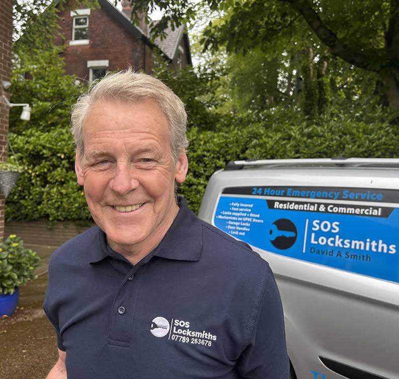 David A Smith of SOS Locksmiths standing beside his branded van