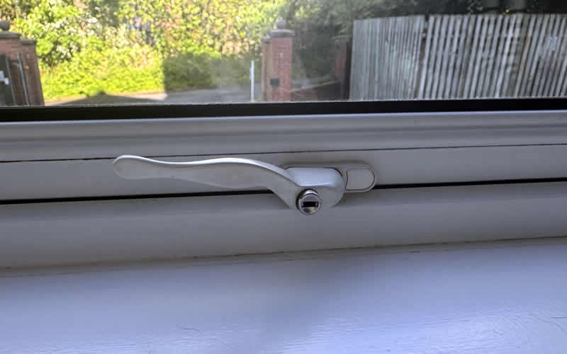 White key-locking handle on a uPVC window